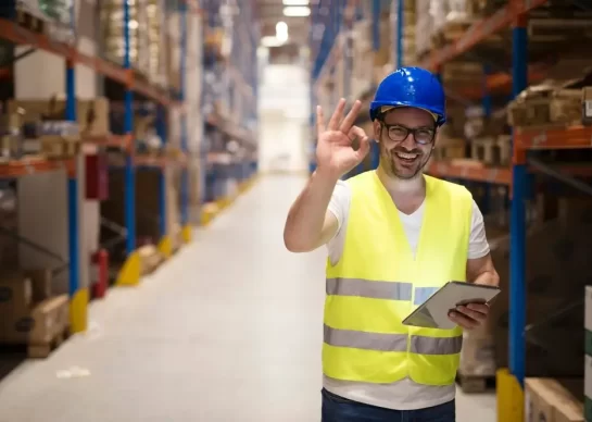 warehouse-worker-standing-large-storage-center-showing-ok-hand-gesture-satisfied-delivering-goods_342744-1526