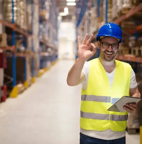 warehouse-worker-standing-large-storage-center-showing-ok-hand-gesture-satisfied-delivering-goods_342744-1526